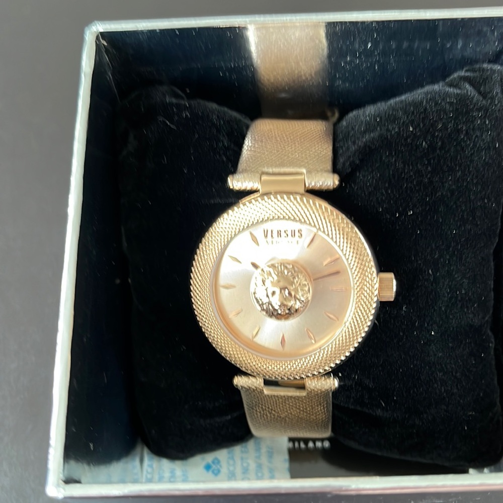 Versace rose colored band watch never worn.
